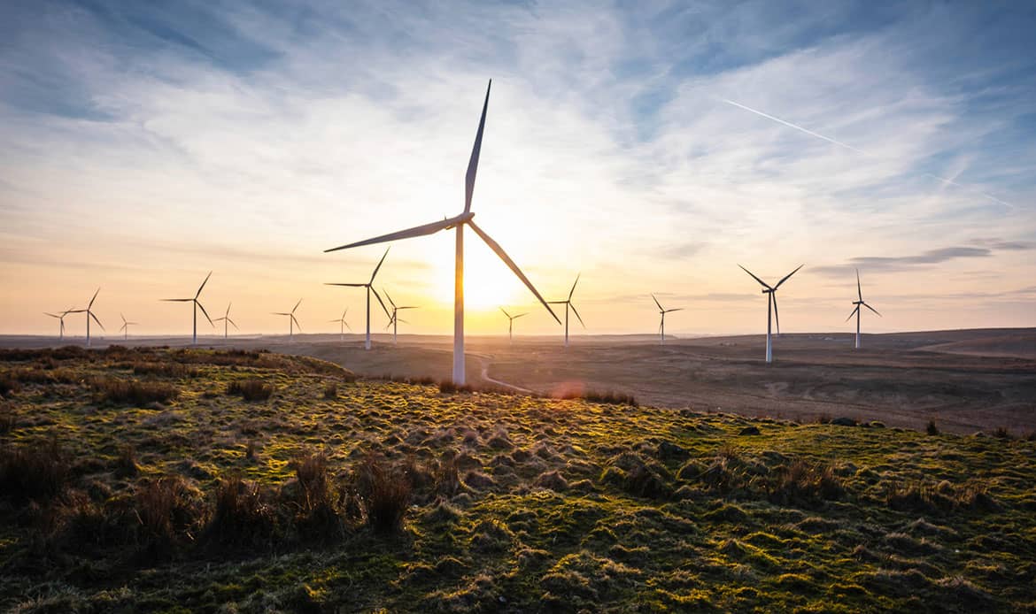Onshore wind farm on upland moor at sunset