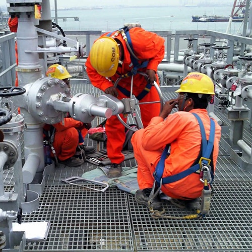 Engineers working on process valves