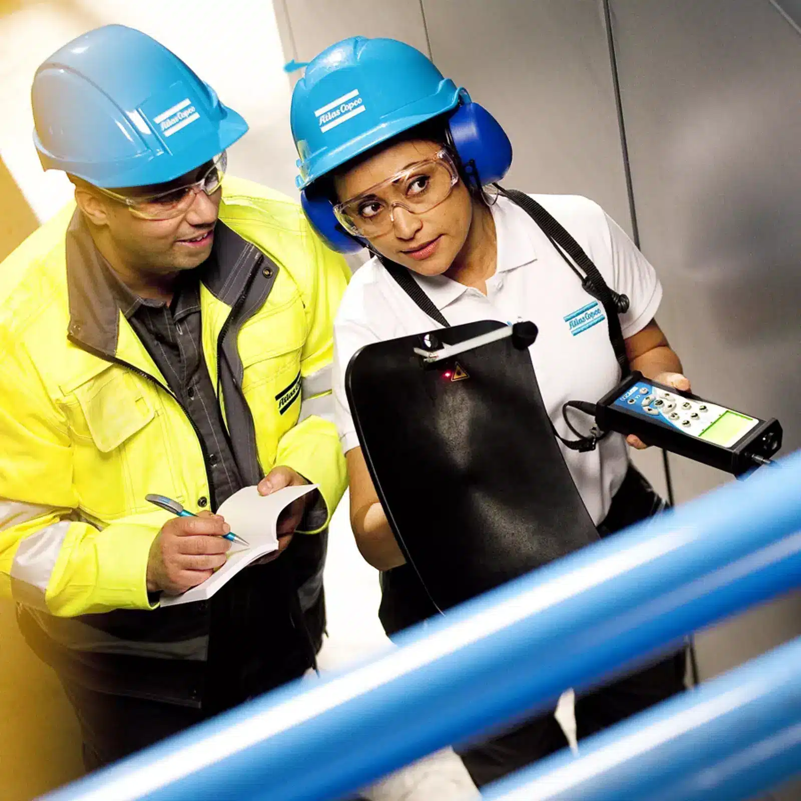 Two engineers reviewing a compressed air survey