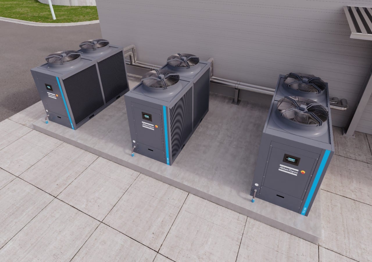 Atlas Copco air-cooled chillers outside a plant room