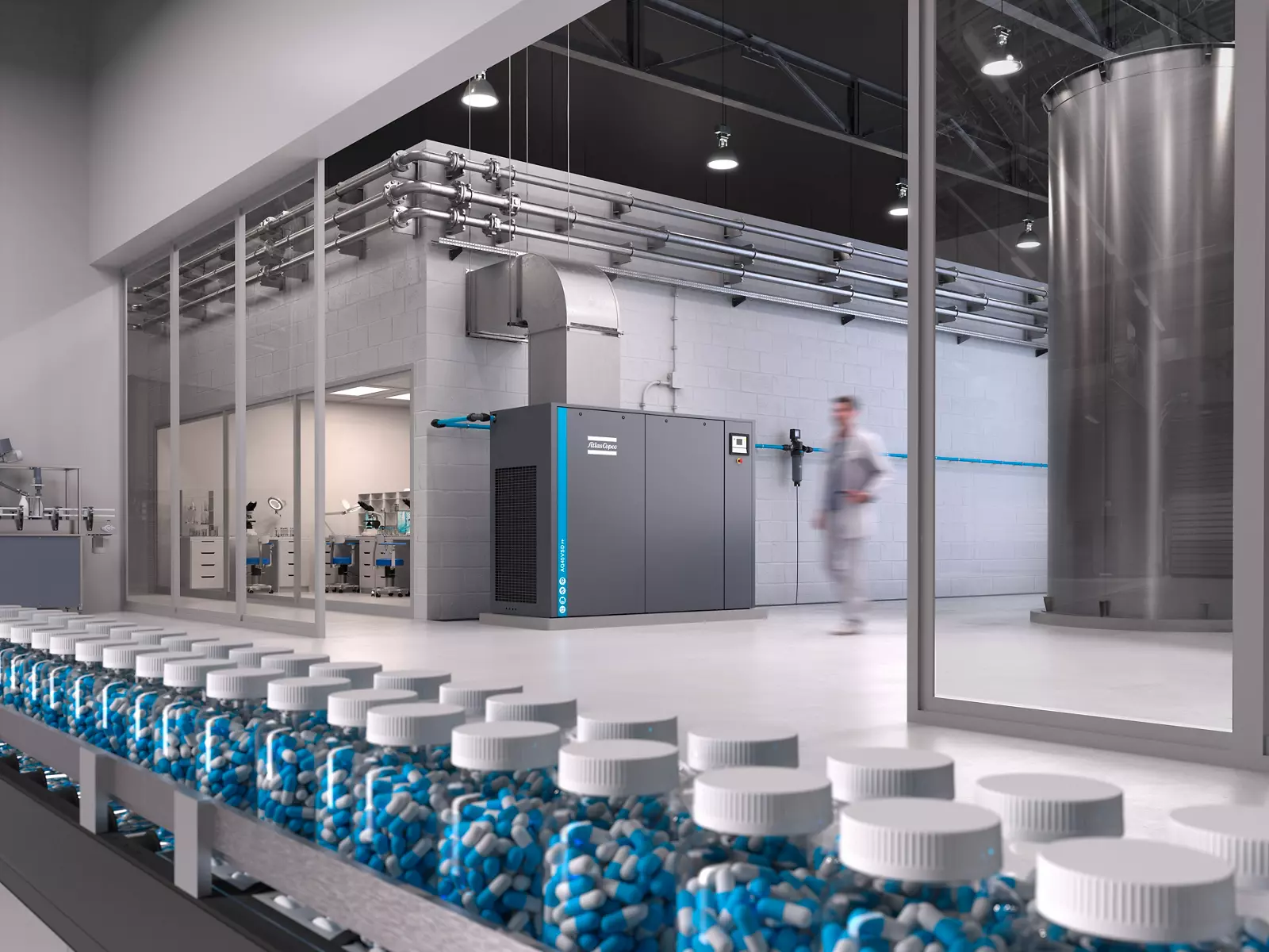 Atlas Copco compressor beside a pharmaceutical capsule bottling line